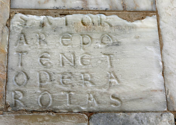 ancient marble engraving of the Sator Square, a mysterious Latin palindrome inscription