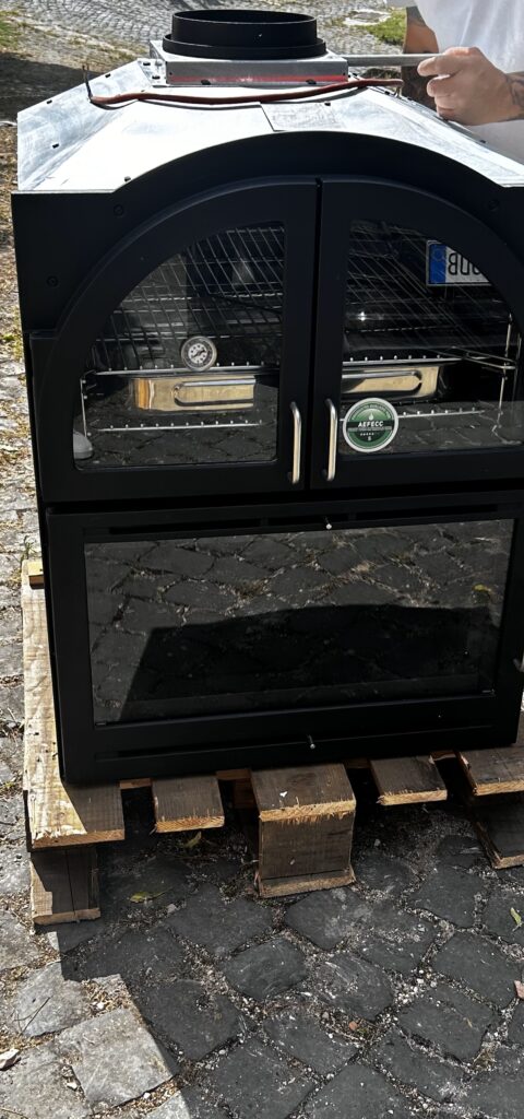 Unpacked wood oven ready for installation during an Italian kitchen renovation.