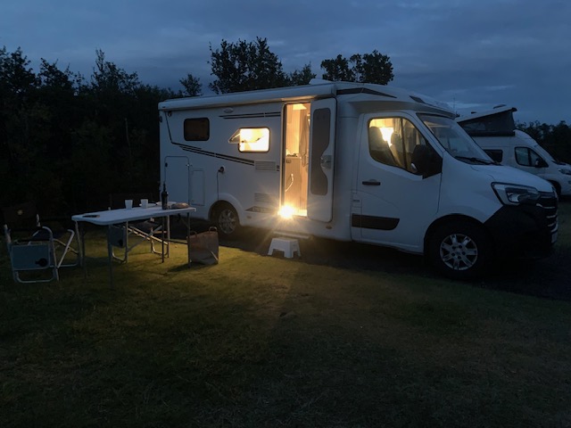 Our campervan parked at Farmhouse Lodge near Vík during our Iceland Ring Road campervan trip.