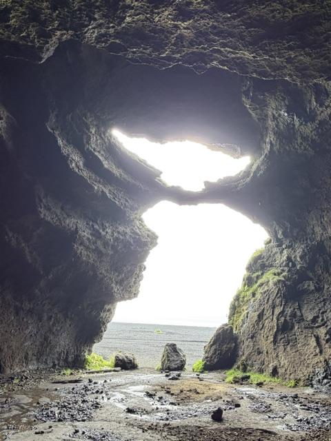View from inside Yoda Cave looking through the distinctive opening toward the Icelandic landscape.