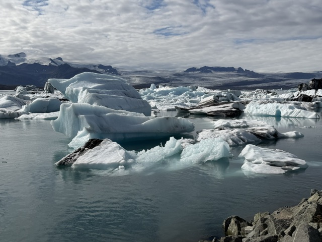 Icebergs floating across Jökulsárlón Glacier Lagoon on their journey toward Diamond Beach in Iceland.