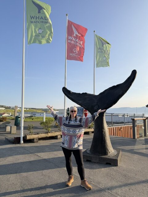 Standing in front of the whale watching expedition before heading out to see whales in North Iceland.