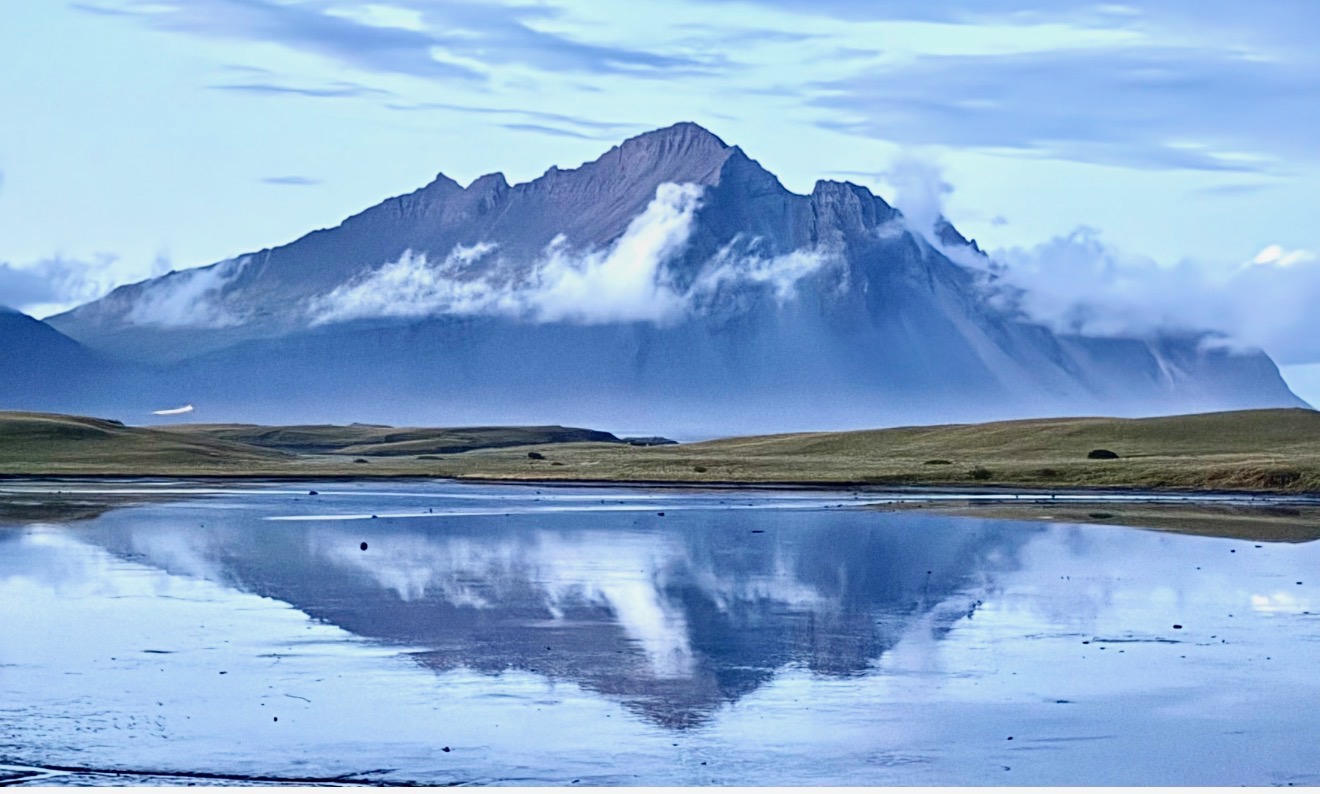 Vestrahorn mountain reflected in water during our Iceland Ring Road campervan trip