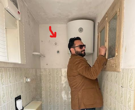 Shower inside our old Italian bathroom with a 480V electrical connection beside the tub