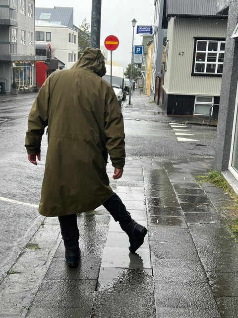 Wearing raincoats while exploring Reykjavík, Iceland, during a rainy day